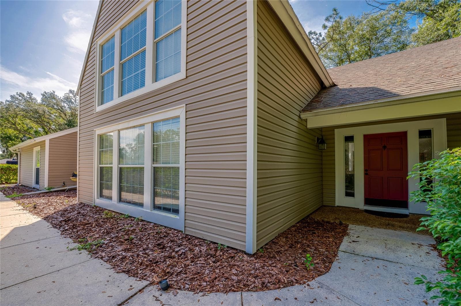 Direct overhead aerial view outlining the home's generous lot boundary surrounded by dense tree cover, a curved driveway, and a private pool enclosure. - 2081 PENNSYLVANIA DR, DELAND
