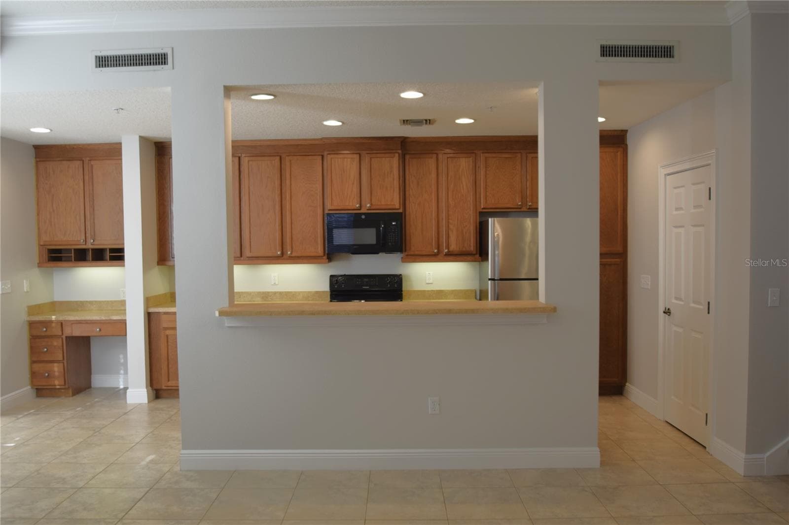 View of kitchen from family area. - 1352 LAKE BALDWIN LN #A, ORLANDO