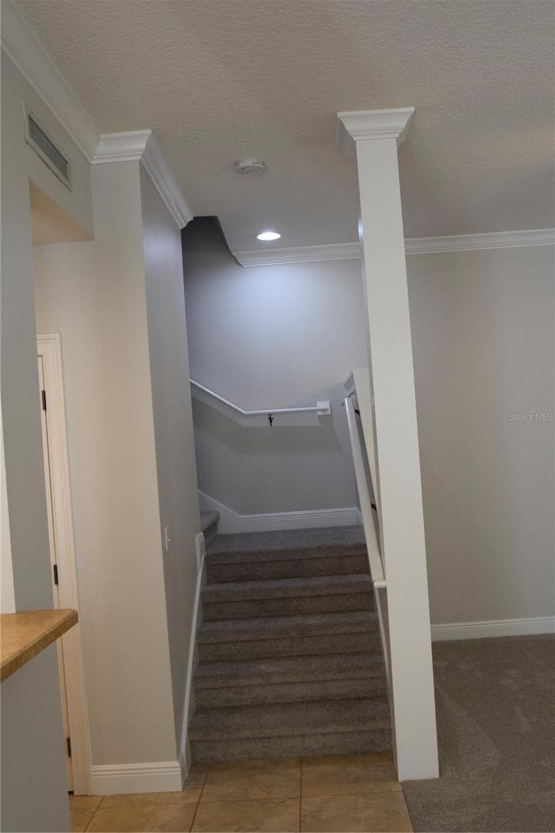 Stairs leading to 3 spacious bedrooms, two full bathrooms, and 10' ceilings upstairs. - 1352 LAKE BALDWIN LN #A, ORLANDO