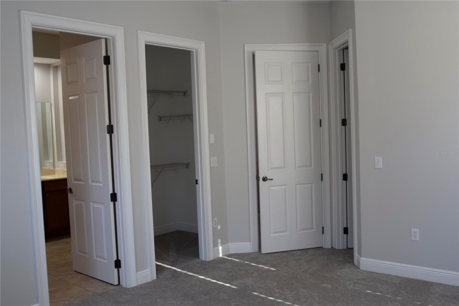 Primary bath entry on left side with two spacious walk-in closets - a great primary bedroom feature hard to find. - 1352 LAKE BALDWIN LN #A, ORLANDO
