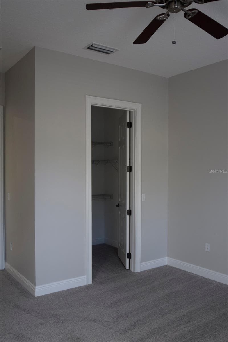 Bedroom #2 walk-in closet. - 1352 LAKE BALDWIN LN #A, ORLANDO