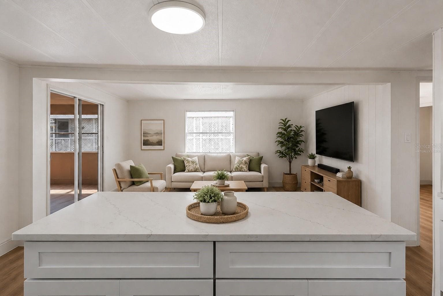 Virtually Staged. Large kitchen island with breakfast bar, solid surface counter tops - 2055 S FLORAL AVE #55, BARTOW