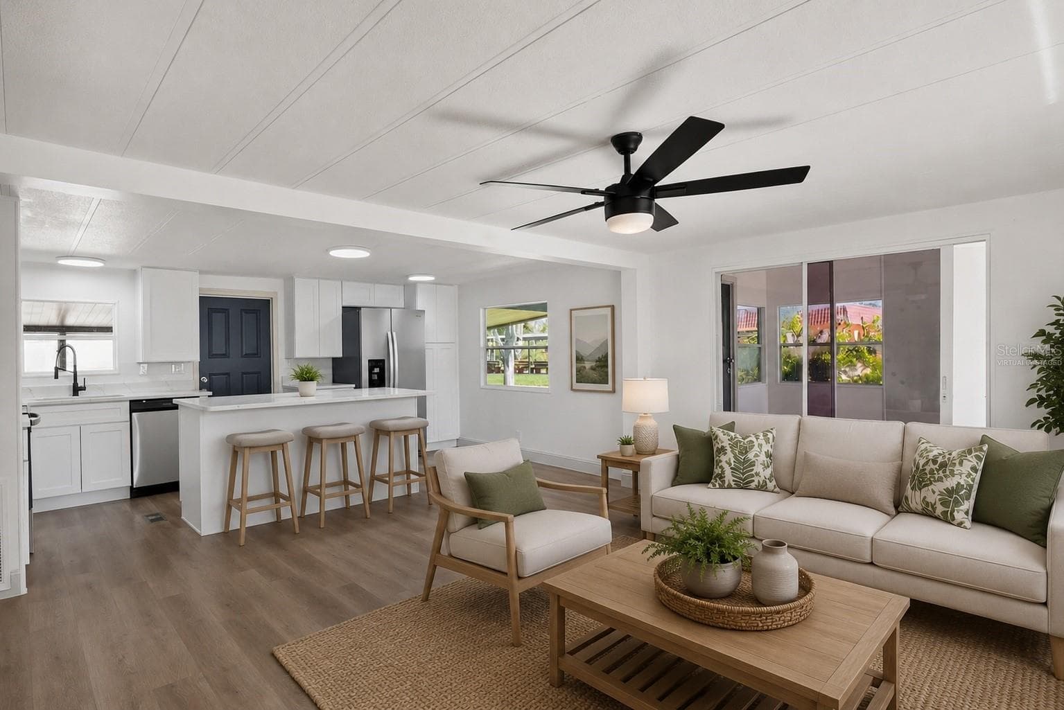 Virtually Staged. Living Room, with sliding door to Florida Room - 2055 S FLORAL AVE #55, BARTOW