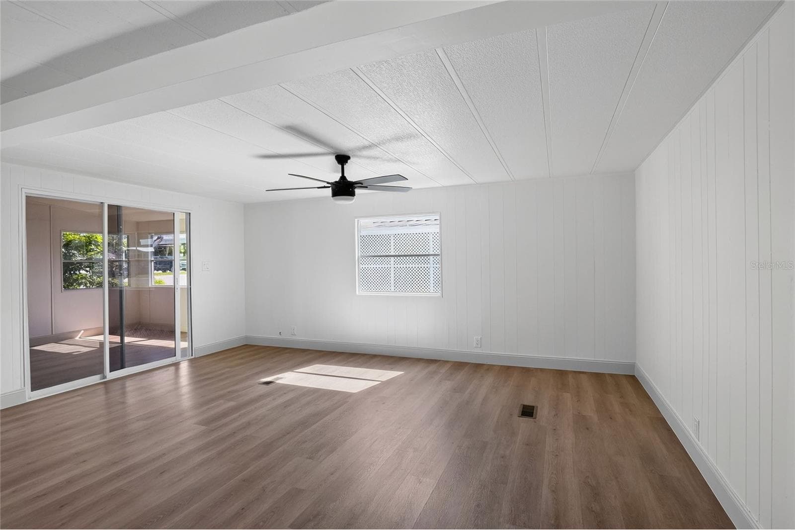 Living Room, with sliding door to Florida Room - 2055 S FLORAL AVE #55, BARTOW