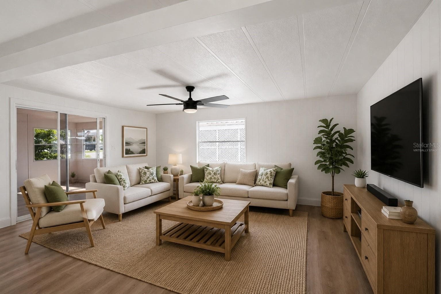 Virtually Staged. Living Room, with sliding door to Florida Room - 2055 S FLORAL AVE #55, BARTOW