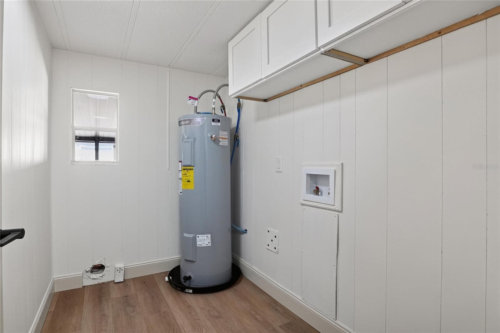 Interior Laundry Room with new water heater and washer/dryer hookups (hookups only) - 2055 S FLORAL AVE #55, BARTOW