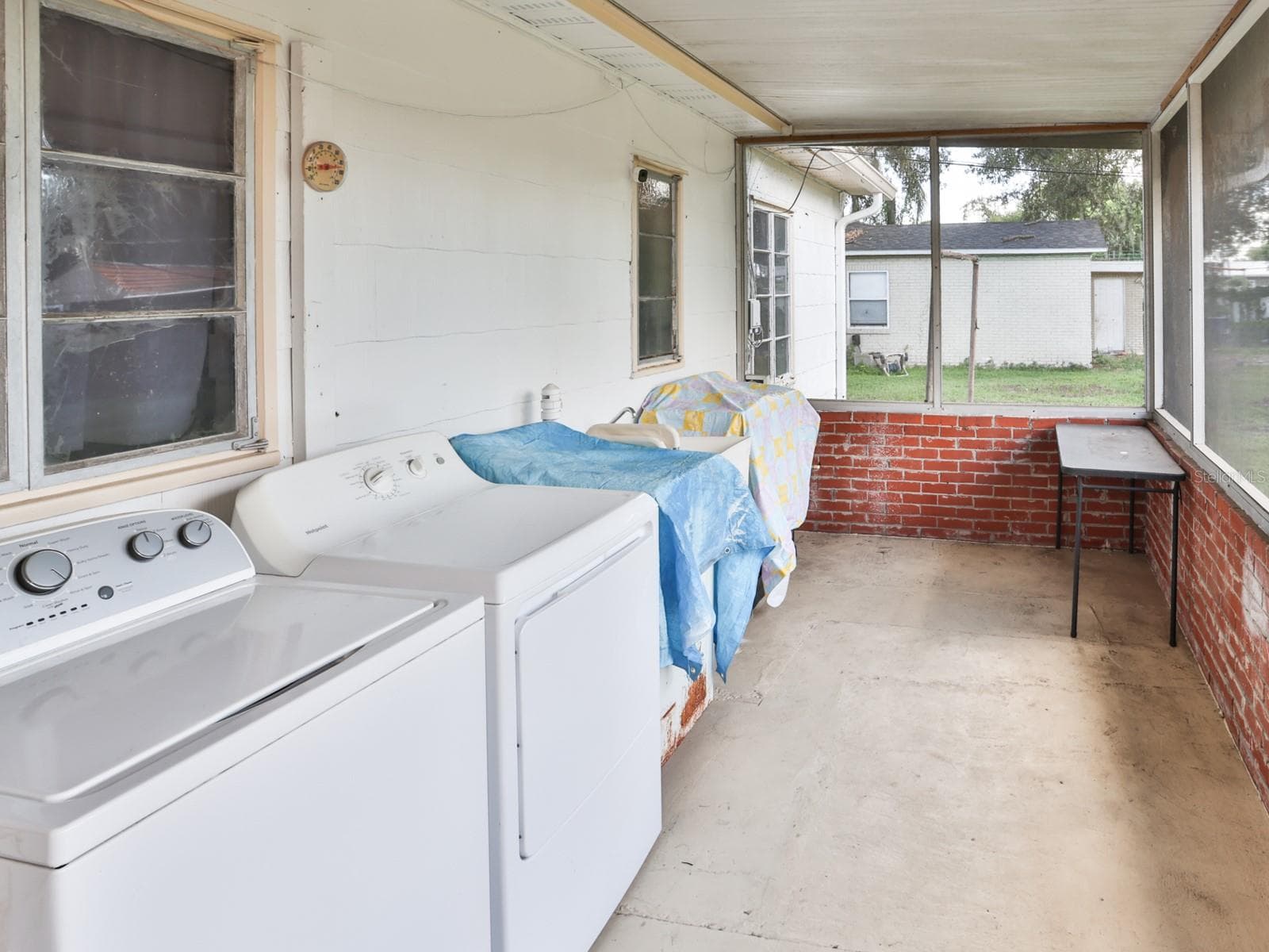 Back porch with washer and dryer. - 1855 E VALENCIA DR, BARTOW
