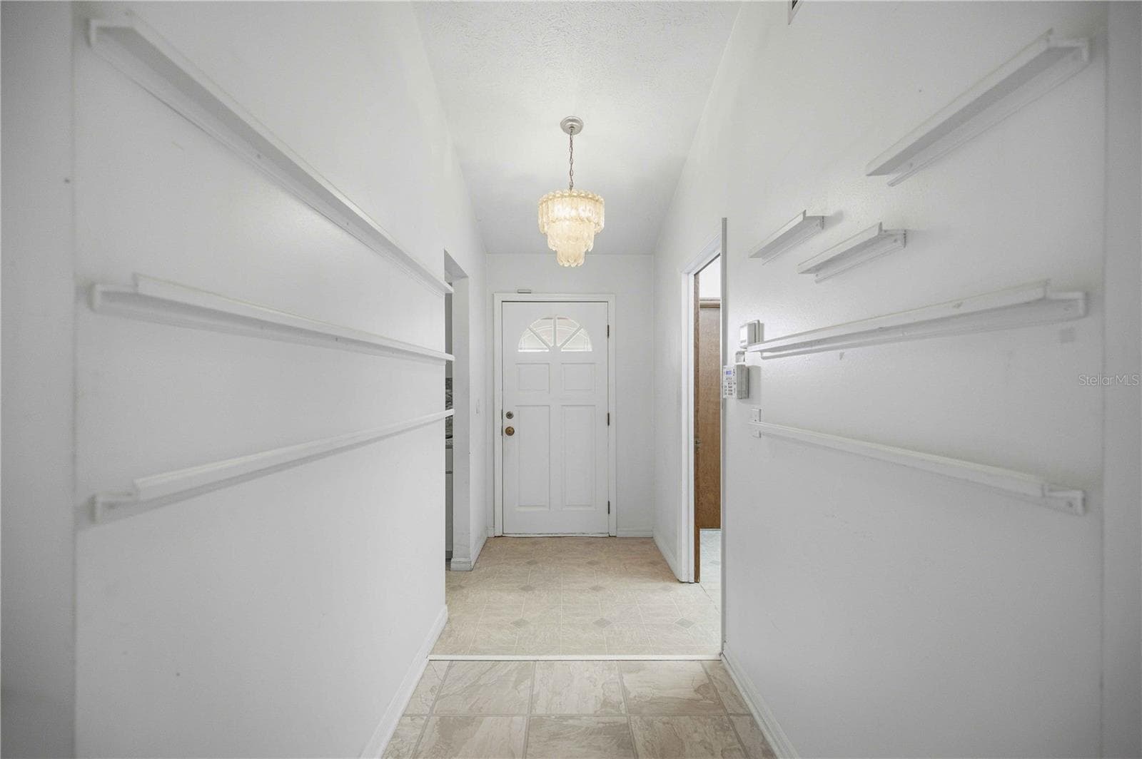 LOOKNG BACK AT FRONT DOOR FROM FOYER - 6500 CHERRY RD, OCALA