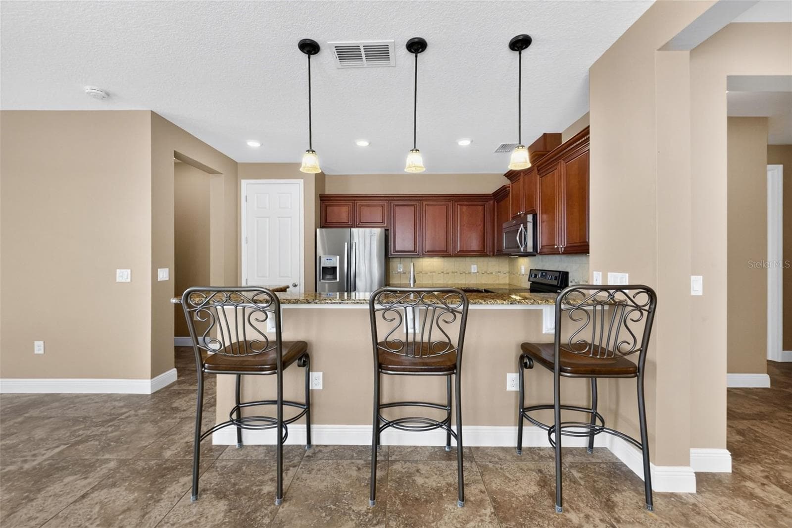 Kitchen Breakfast bar - 8849 TUSCANY ISLES DR, PUNTA GORDA