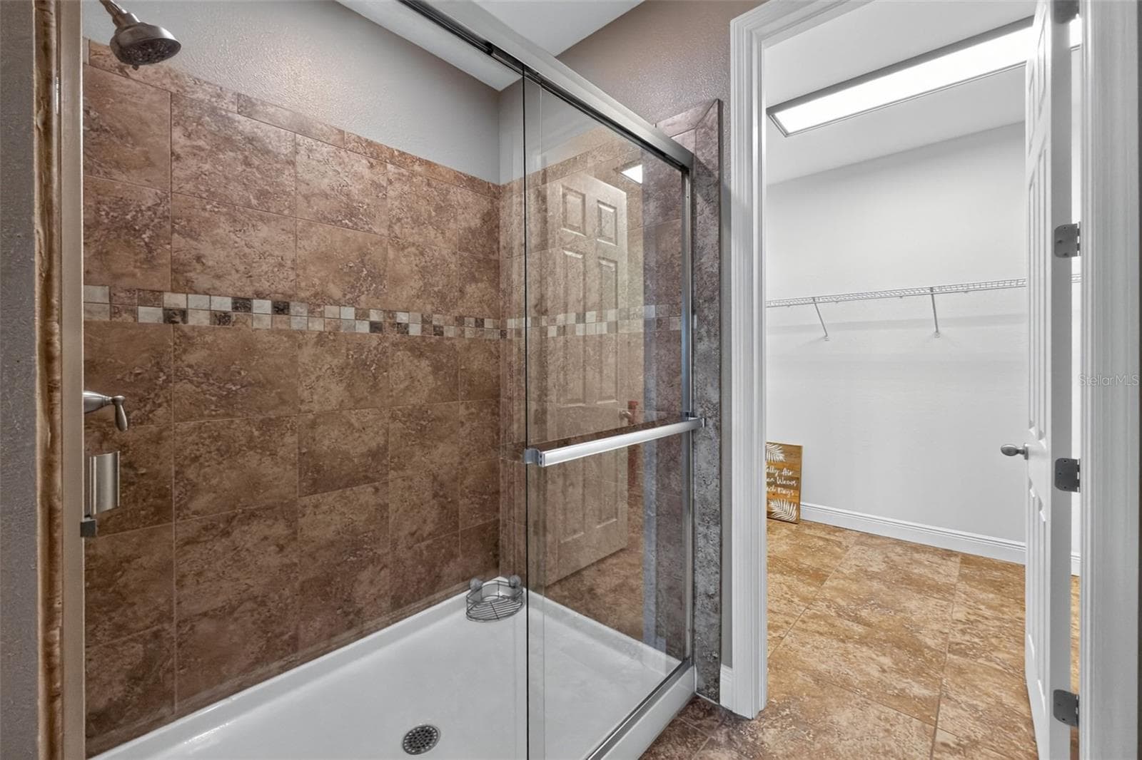 primary bath shower and walk in closet view - 8849 TUSCANY ISLES DR, PUNTA GORDA