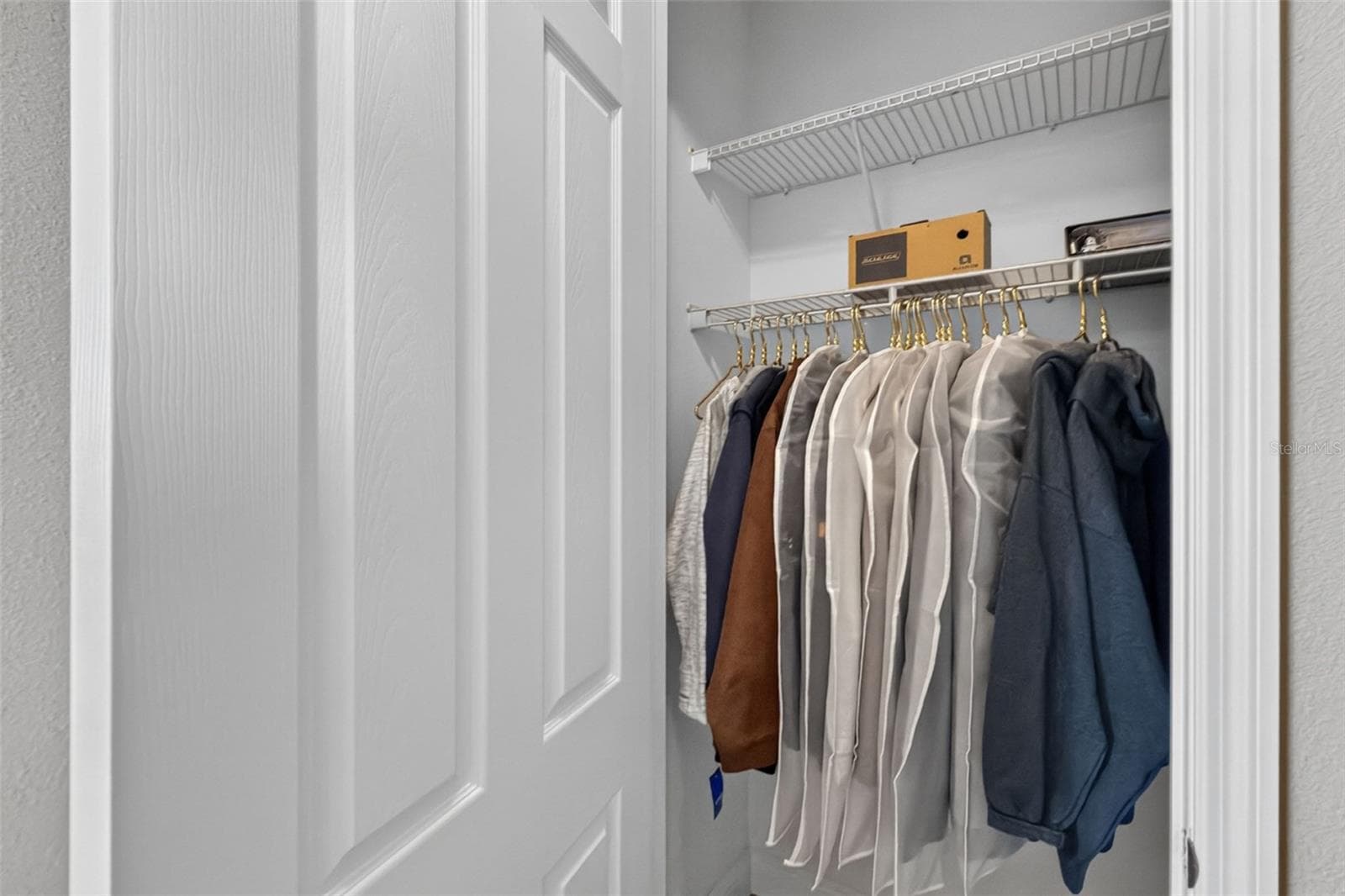 Coat closet in hallway - 8849 TUSCANY ISLES DR, PUNTA GORDA