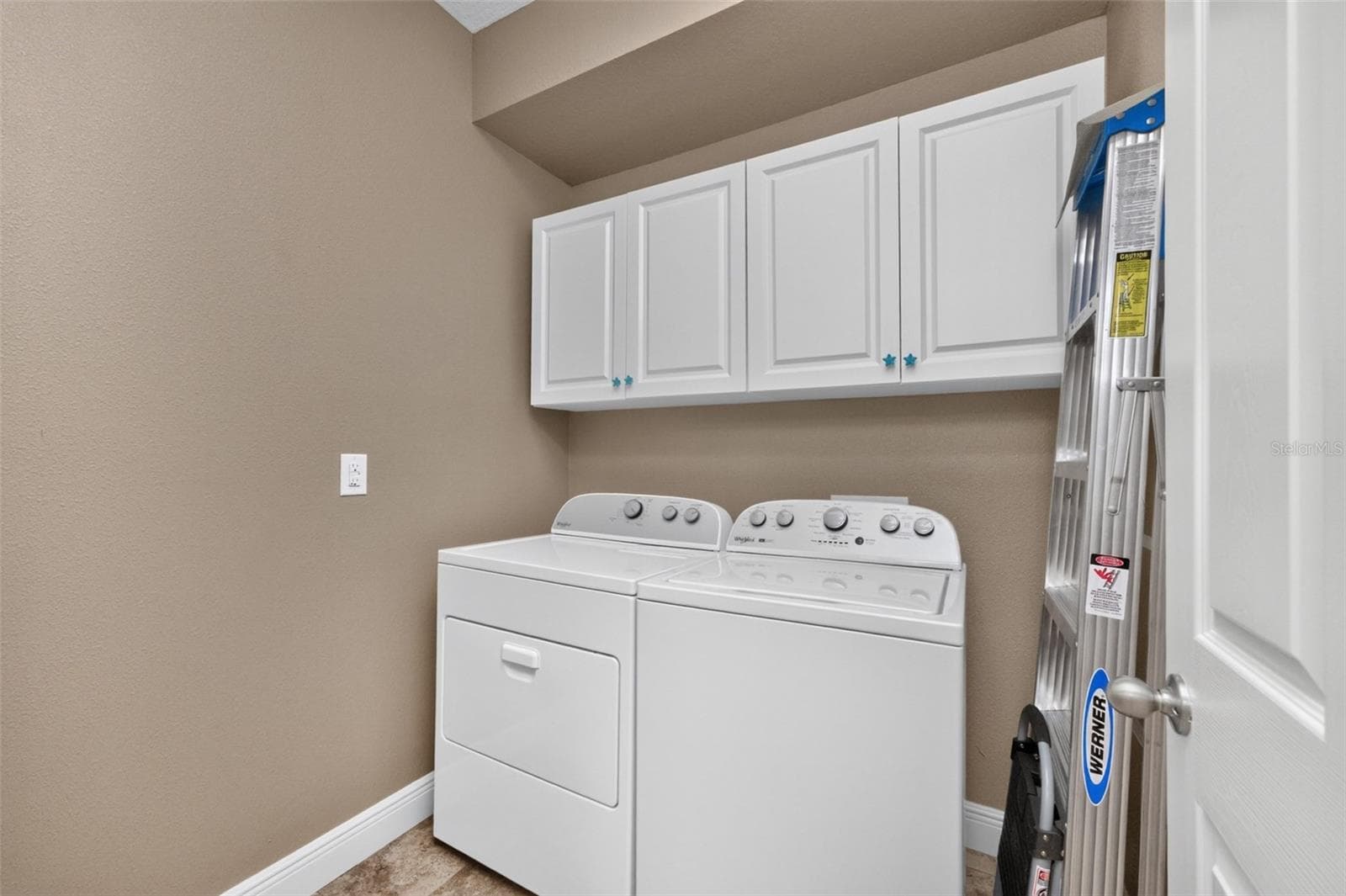 Laundry room with cabinets - 8849 TUSCANY ISLES DR, PUNTA GORDA