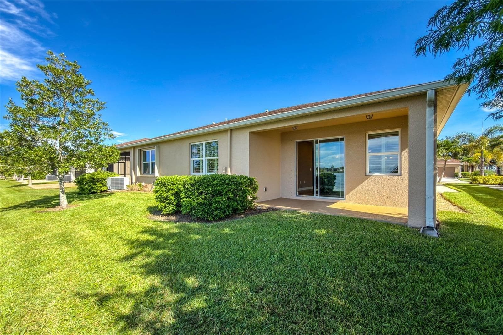 rear of home - 8849 TUSCANY ISLES DR, PUNTA GORDA