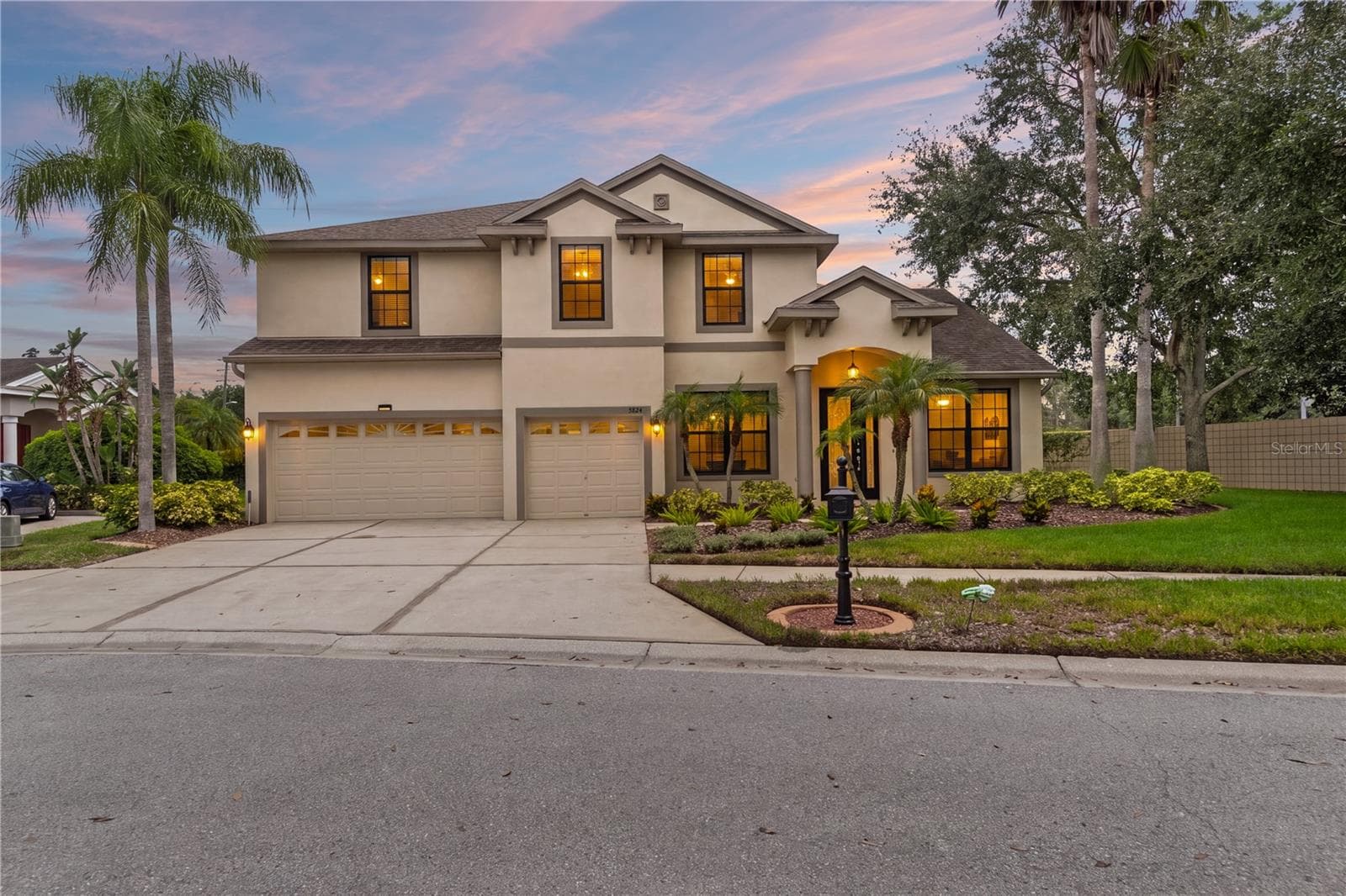 Beautifully landscaped this 4 bedroom 4 bath dream home also has a 3 car garage - 5824 FISH CROW PL, LAND O LAKES