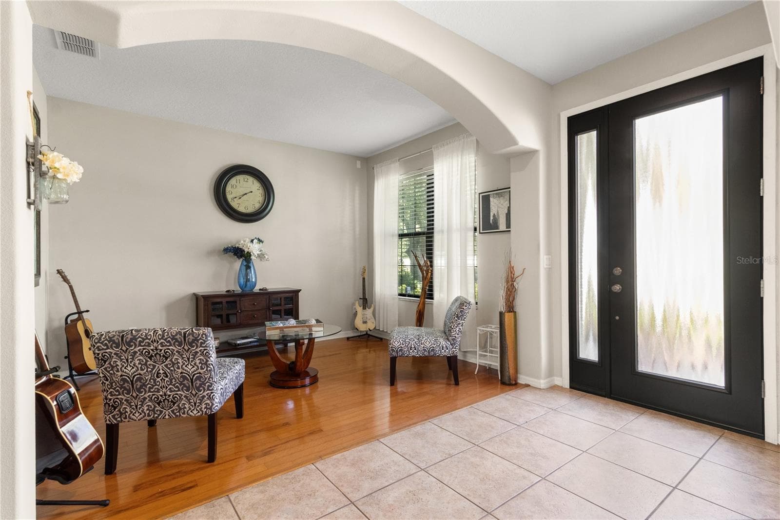 Enter through the glass entryway door to the split foyer. - 5824 FISH CROW PL, LAND O LAKES