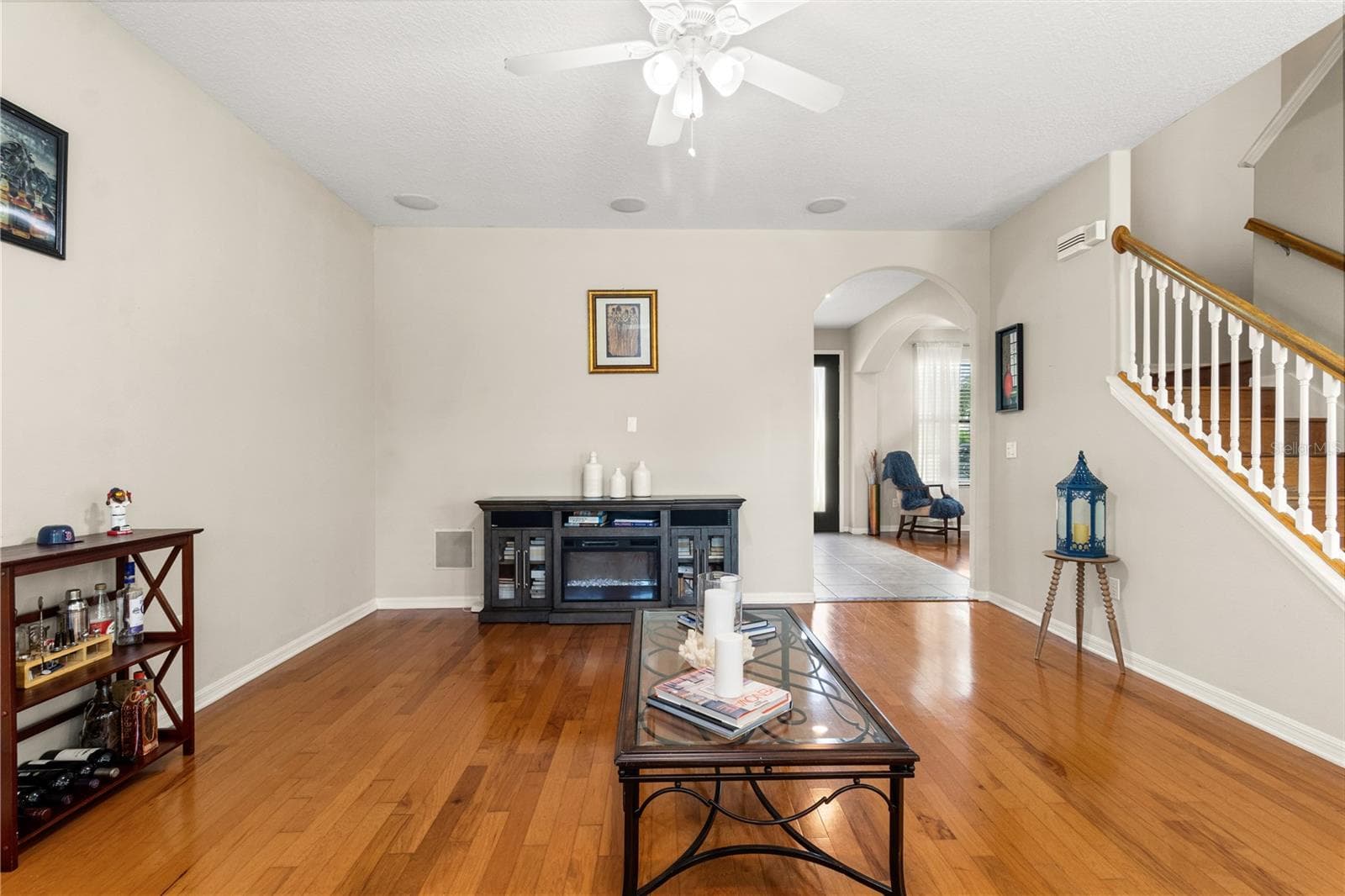 Toward the back of the home sits the expansive family room with windows overlooking the pool. - 5824 FISH CROW PL, LAND O LAKES