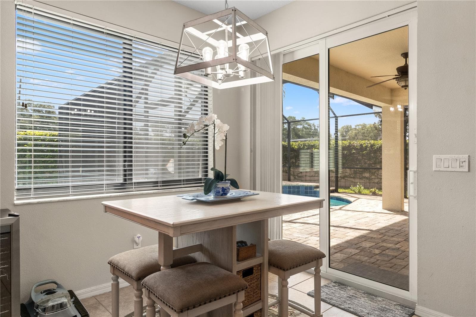 Step through the kitchen sliding doors to the pool - 5824 FISH CROW PL, LAND O LAKES