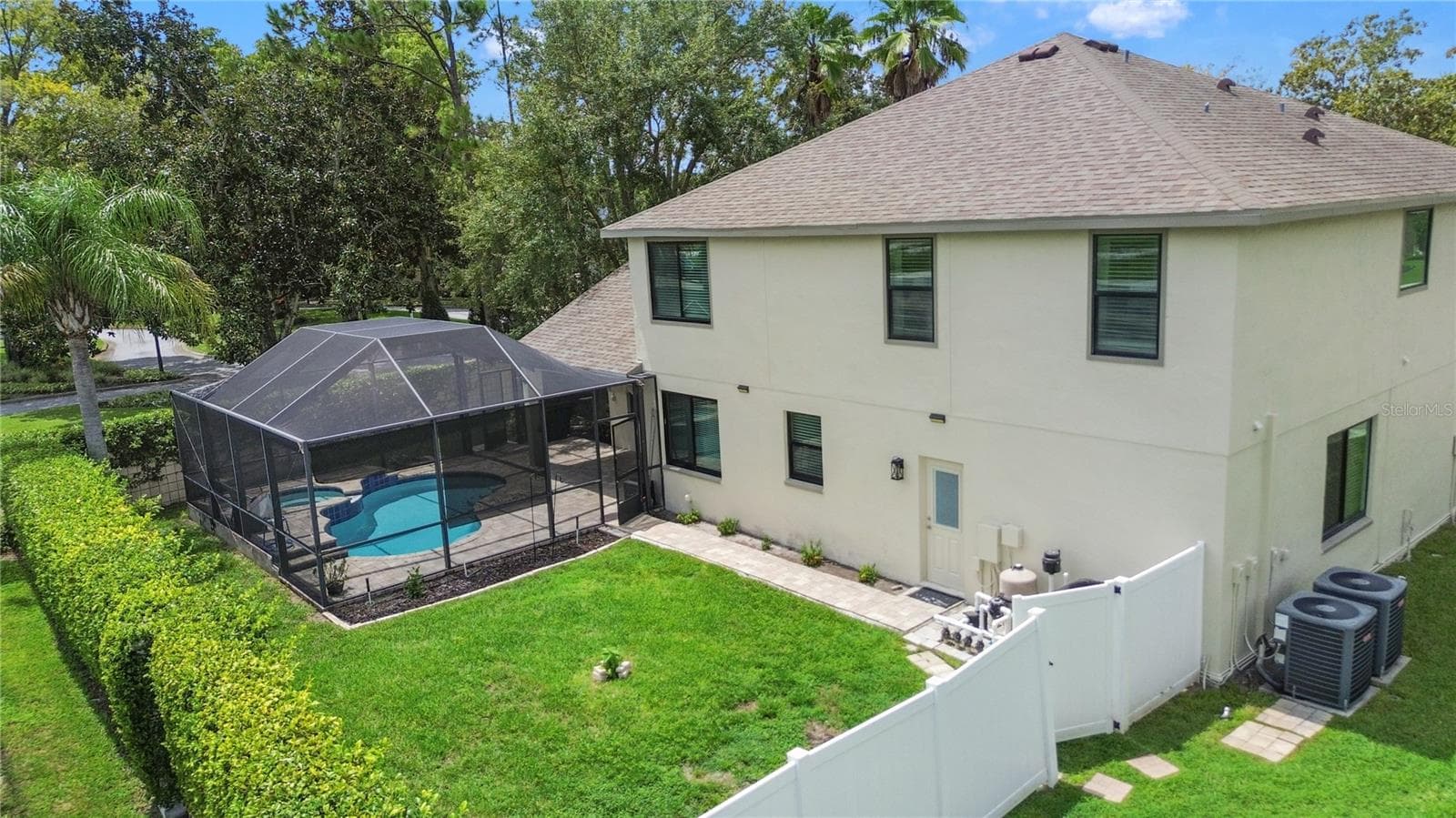 In addition to the pool there is plenty of space in the fully fenced yard - 5824 FISH CROW PL, LAND O LAKES