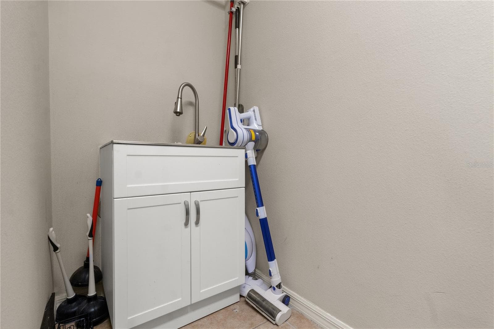 Laundry room sink - 5824 FISH CROW PL, LAND O LAKES