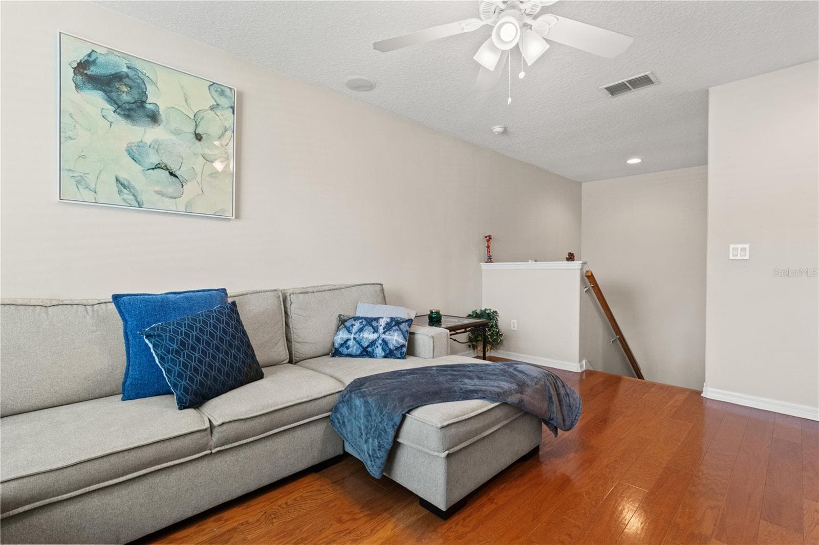 The hardwood floors in the upstairs loft provide a touch of luxury - 5824 FISH CROW PL, LAND O LAKES