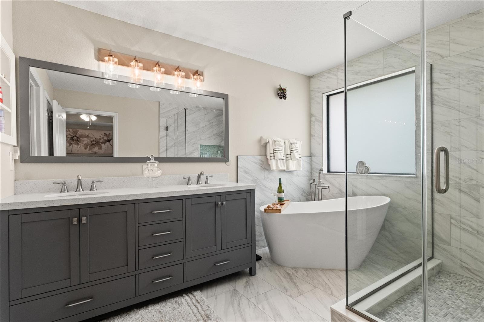 Double vanities in the primary bathroom - 5824 FISH CROW PL, LAND O LAKES