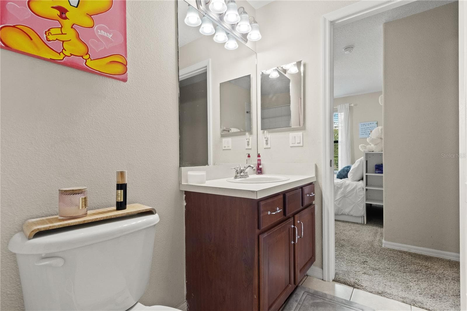 En suite bathroom connected to one of the secondary bedrooms - 5824 FISH CROW PL, LAND O LAKES