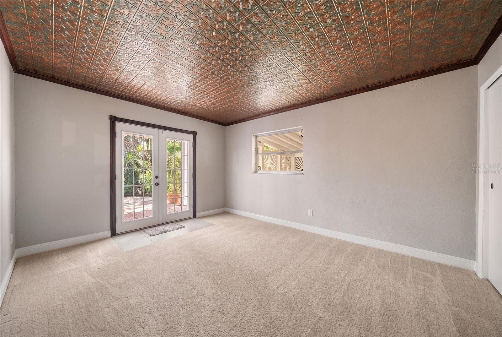 Bedroom - Virtually Staged with Carpet - French Door leading to private fenced yard - 3033 82ND WAY N, ST PETERSBURG