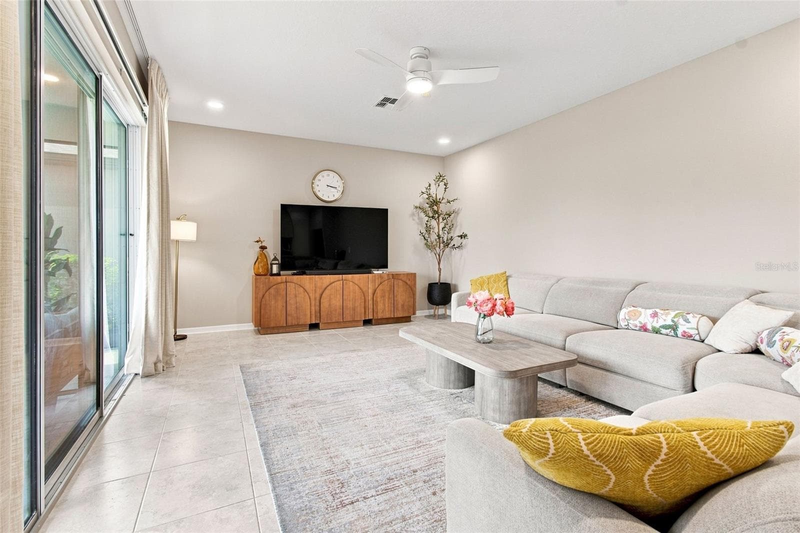 Beautiful porcelain tile floors throughout the living, dining, and kitchen areas - 31840 SAPNA CHIME DR, WESLEY CHAPEL