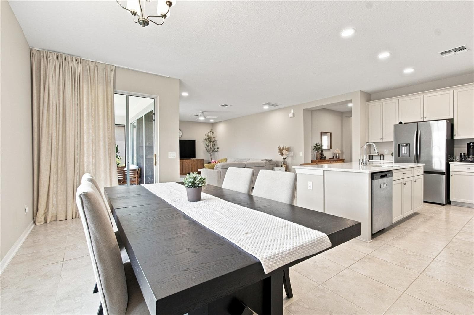 Dining area that comfortably fits an eight-seater - 31840 SAPNA CHIME DR, WESLEY CHAPEL