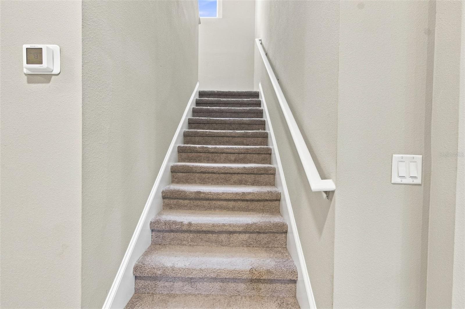 Staircase leading to the family room and three bedrooms - 31840 SAPNA CHIME DR, WESLEY CHAPEL