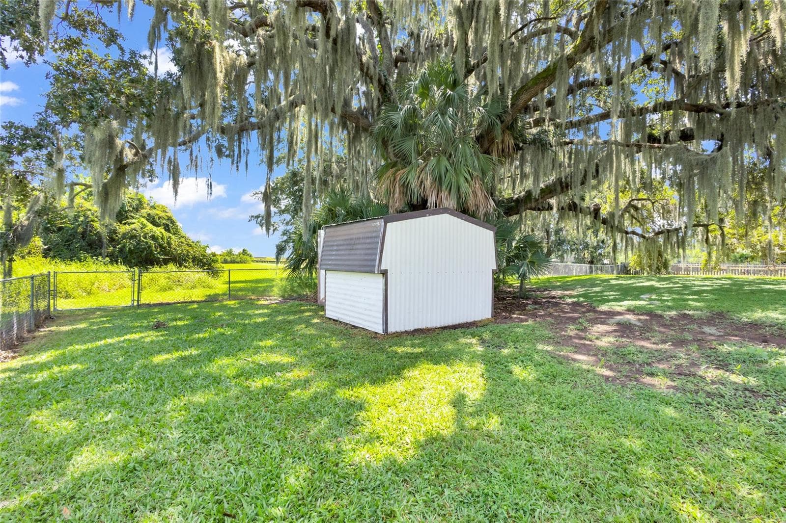 Tool shed and fenced area. - 2805 LAKE TOHOPEKALIGA BLVD, KISSIMMEE