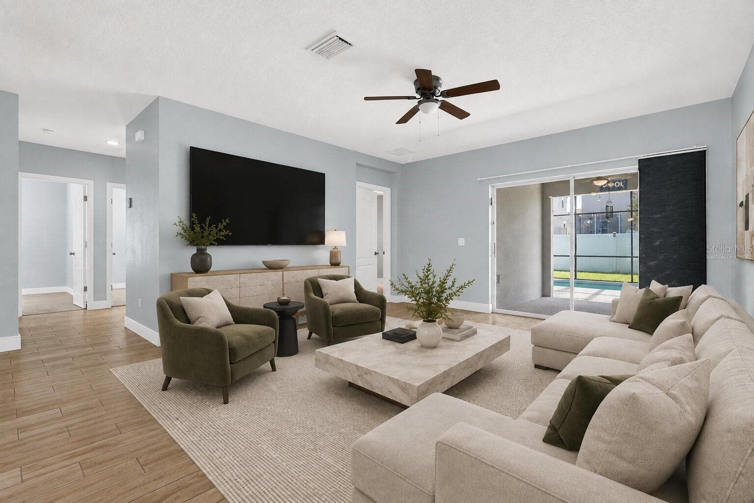 Virtually Staged Living Room leading to the lanai - 878 BENJAMIN TRL, DAVENPORT