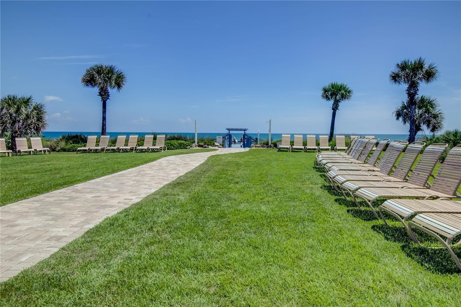 Plenty of lounge chairs along pool near beach - 12 CINNAMON BEACH WAY, PALM COAST