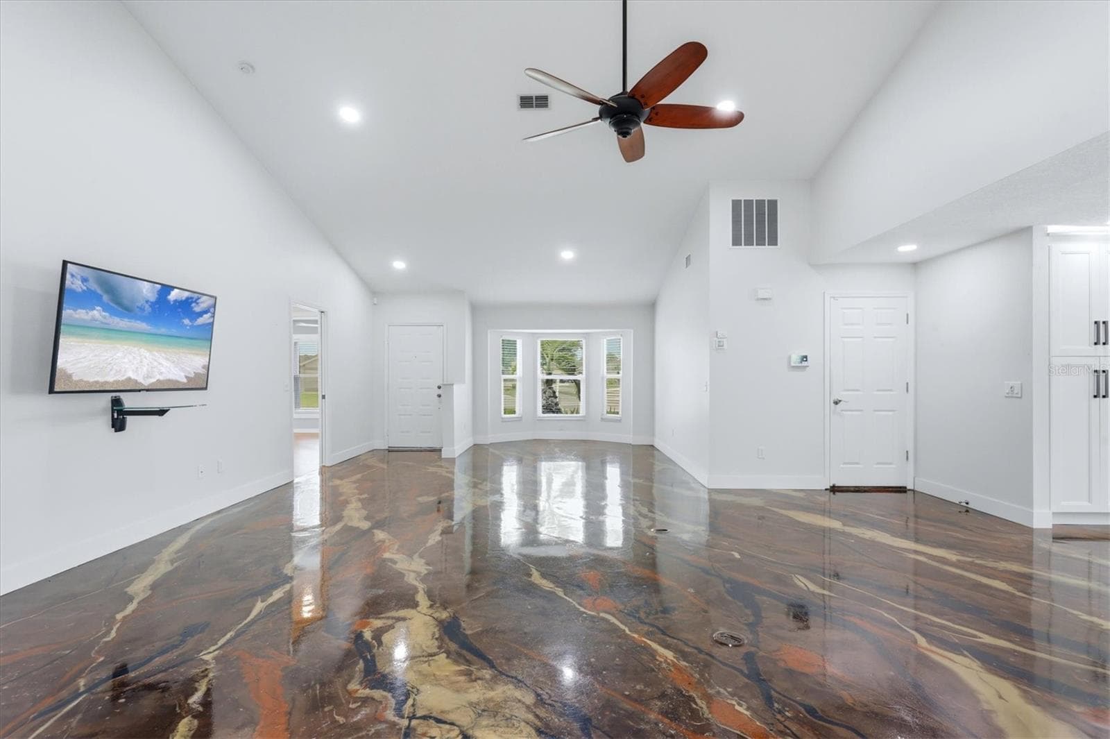 Living and Dining room towards the front door. Access to the garage is the door on the right. - 259 PARK FOREST BLVD, ENGLEWOOD