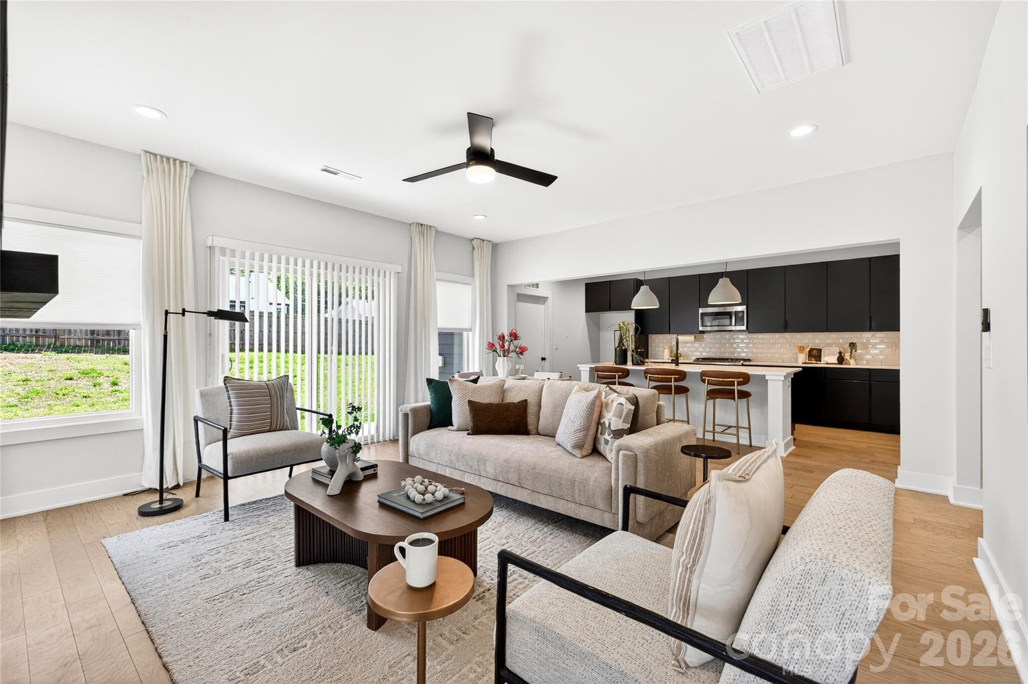 Ceiling fan and sliders to fenced backyard. - 5044 Double Lakes Drive, Charlotte