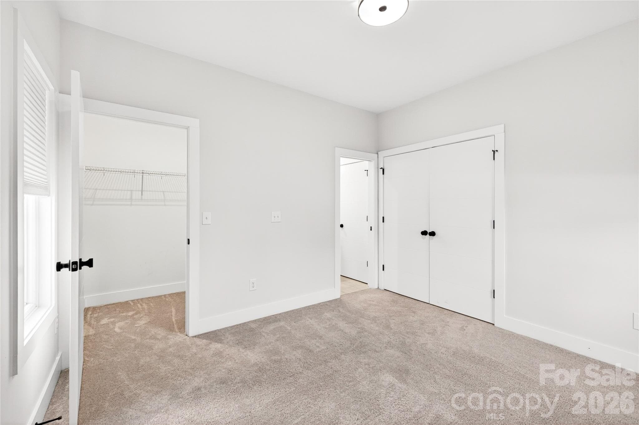 Secondary bedroom also features a walk in closet. - 5044 Double Lakes Drive, Charlotte