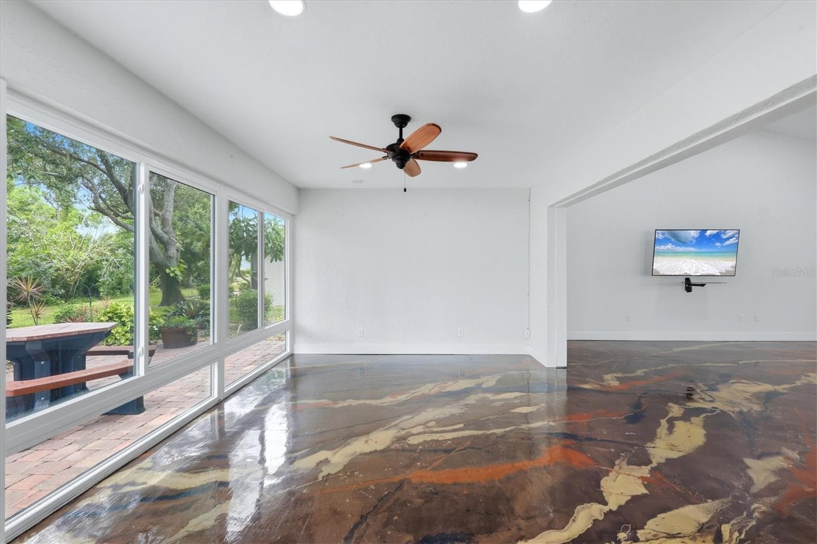 The Florida room features a wall of windows that fills the space with natural light and brings the outdoors in. - 259 PARK FOREST BLVD, ENGLEWOOD