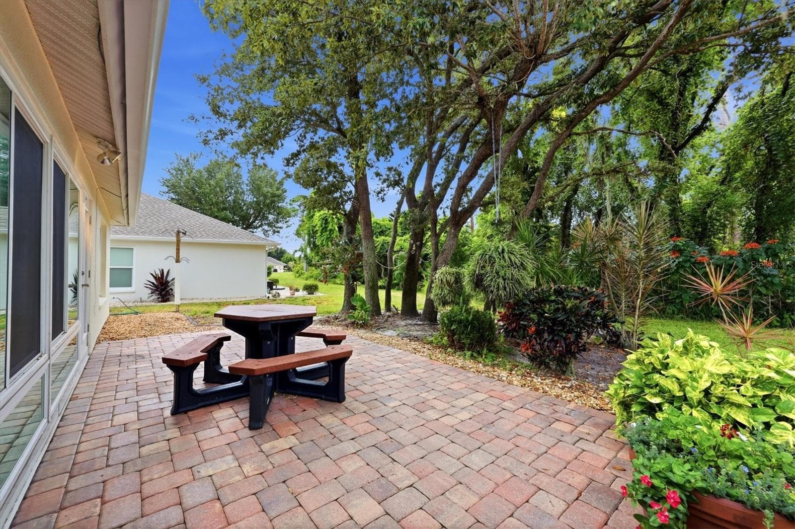 The private backyard has a nice paved paio and wood view. - 259 PARK FOREST BLVD, ENGLEWOOD