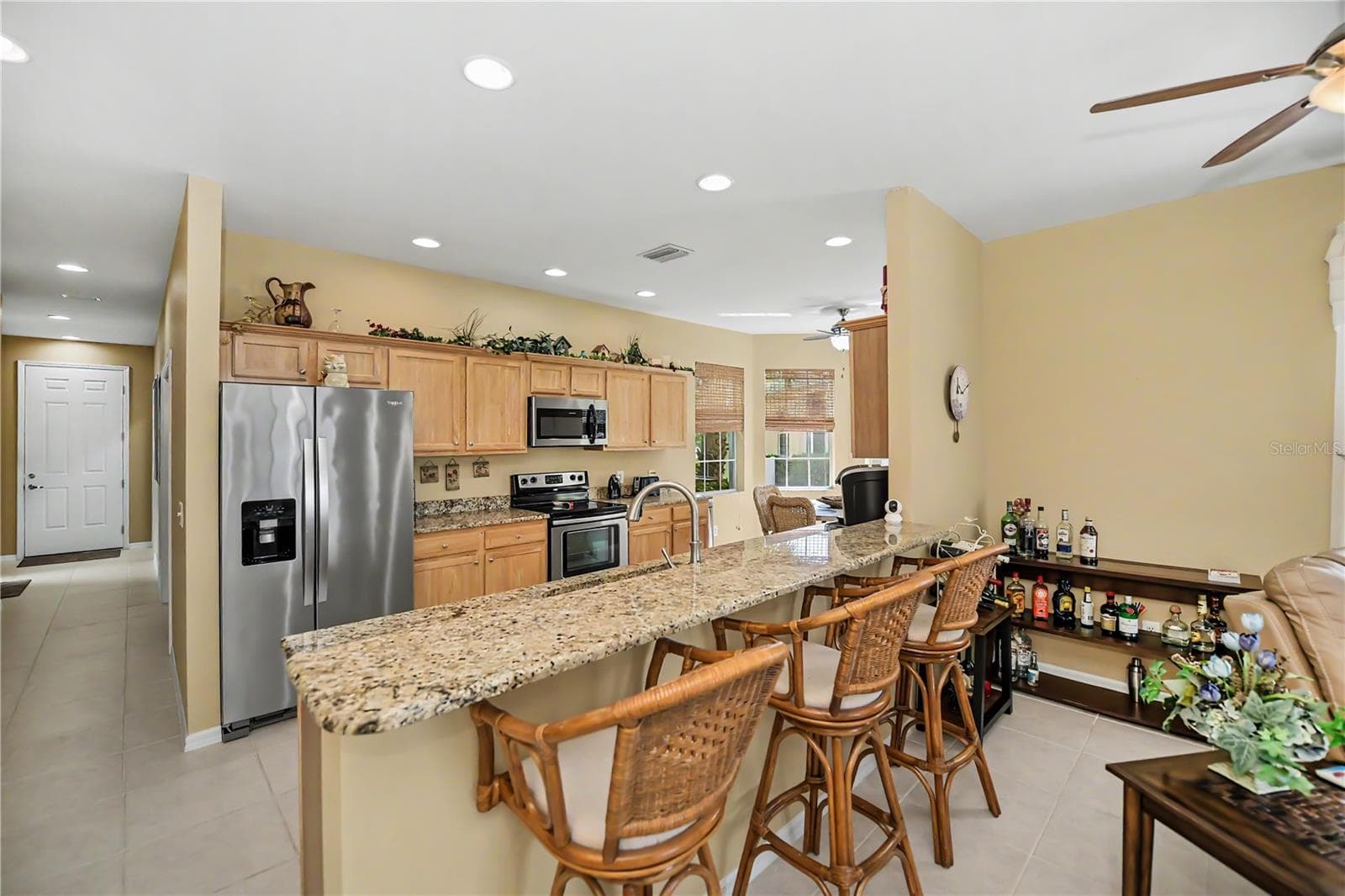 wood cabinets and granite countertops - 25545 HERITAGE LAKE BLVD #21, PUNTA GORDA