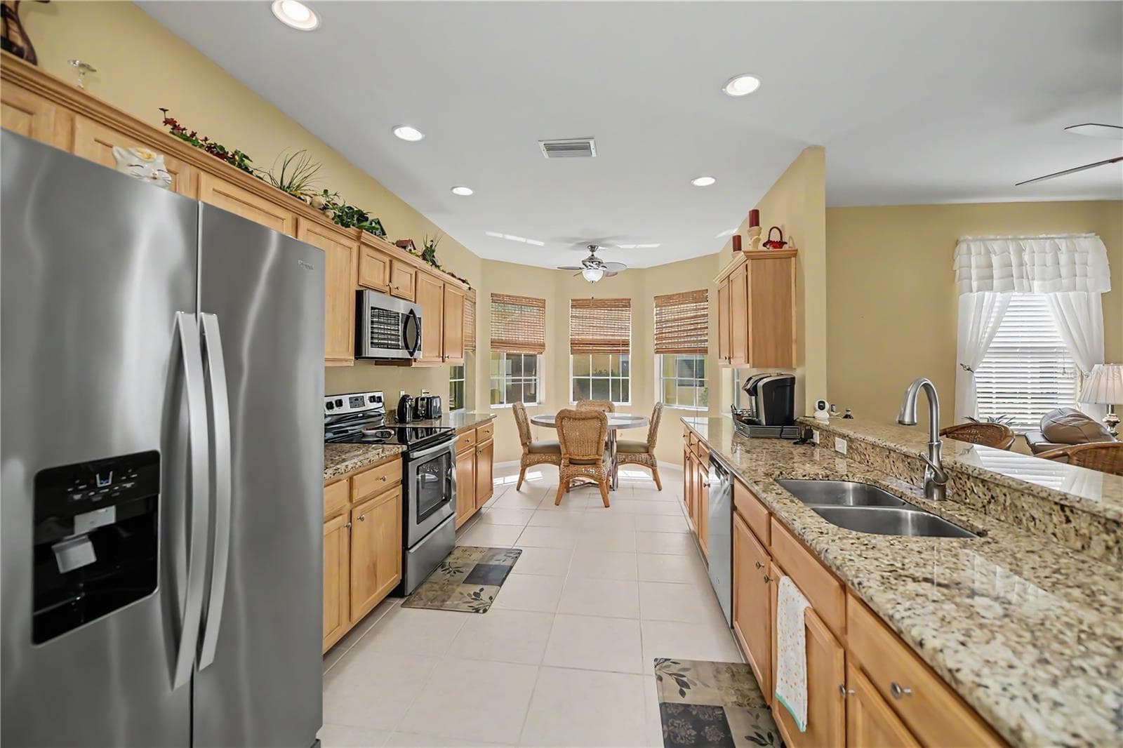 nicely appointed galley style kitchen - 25545 HERITAGE LAKE BLVD #21, PUNTA GORDA