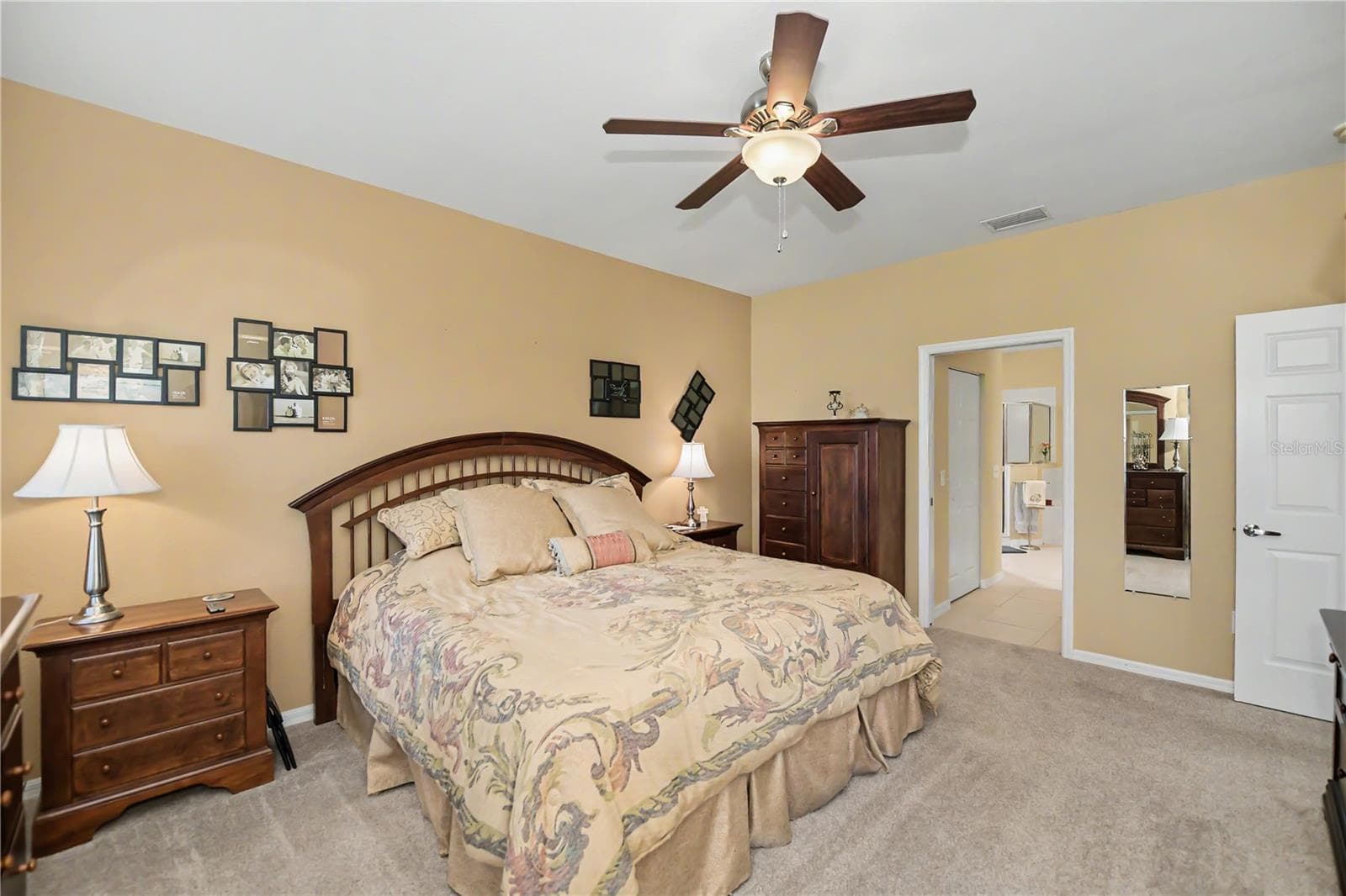 dual walk-in closets on the way to the ensuite bathroom - 25545 HERITAGE LAKE BLVD #21, PUNTA GORDA