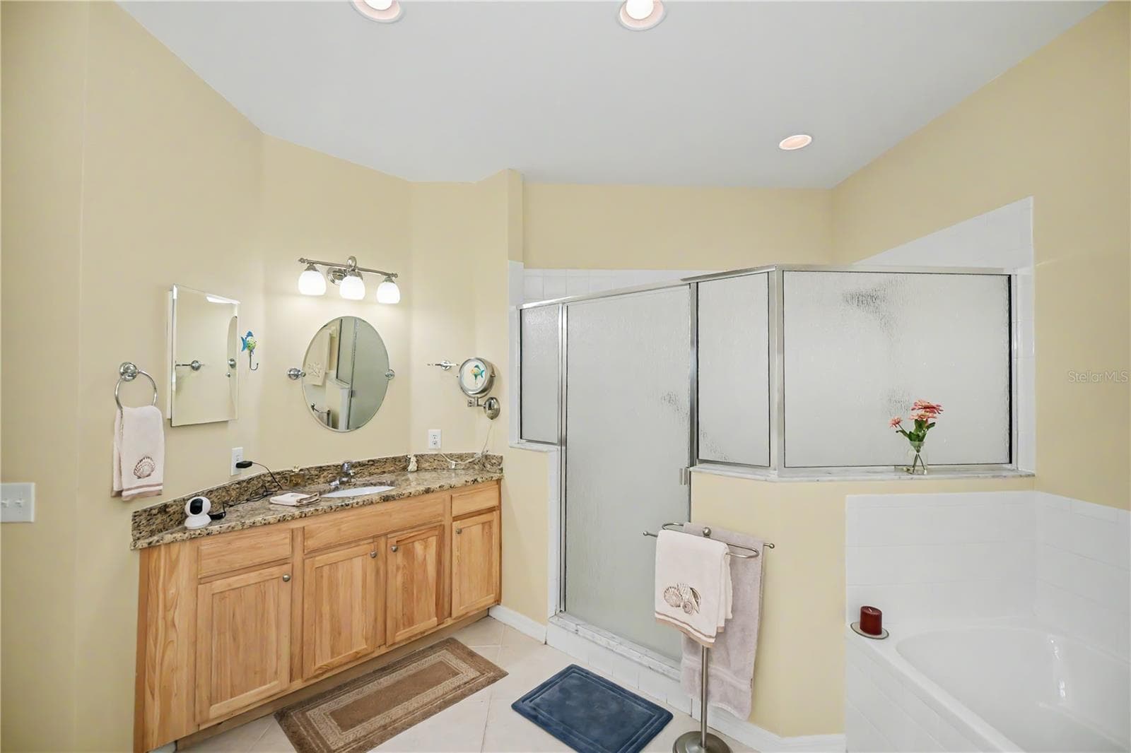 split vanities with walk-in shower and separate soaking tub - 25545 HERITAGE LAKE BLVD #21, PUNTA GORDA