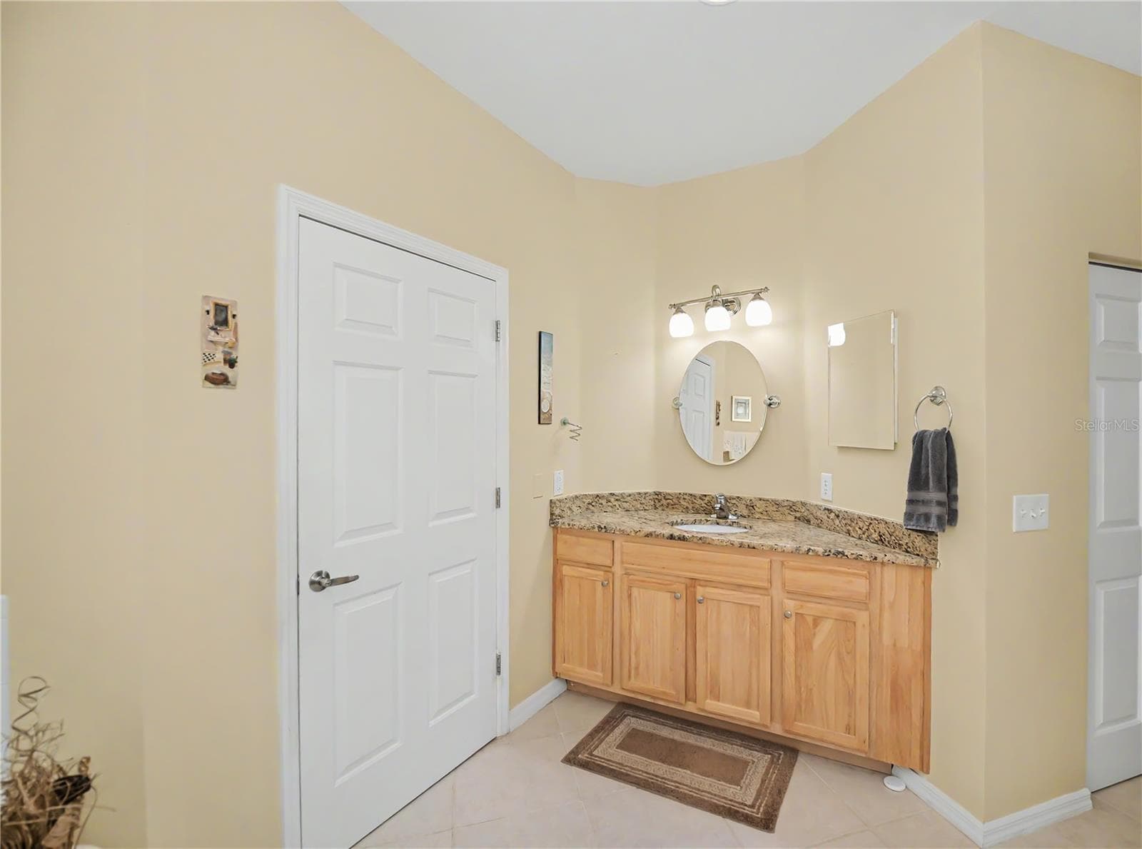 separate vanity with door to water closet - 25545 HERITAGE LAKE BLVD #21, PUNTA GORDA