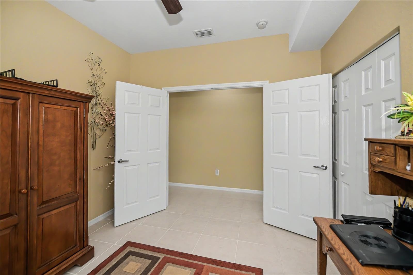 French doors to the 3rd bedroom - 25545 HERITAGE LAKE BLVD #21, PUNTA GORDA