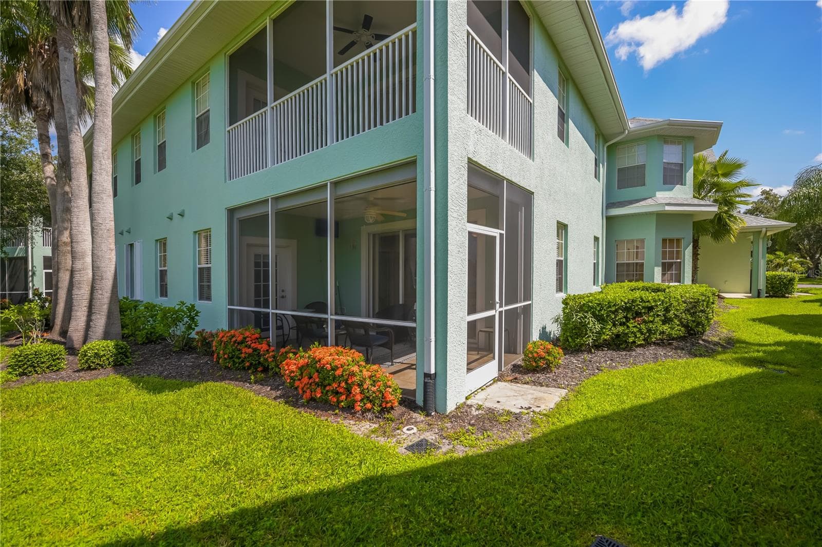 end, corner, bottom floor private, tiled lanai with lush backyard view - 25545 HERITAGE LAKE BLVD #21, PUNTA GORDA
