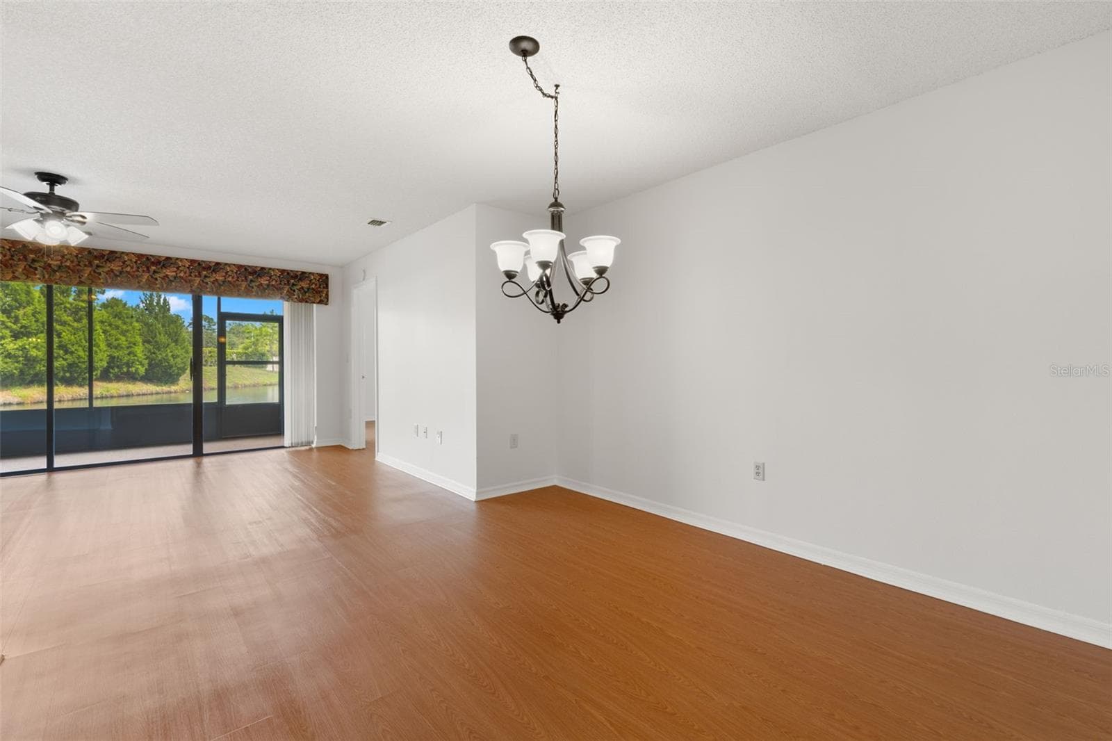 Dining room open to the living room - 1801 E LAKE RD #19D, PALM HARBOR