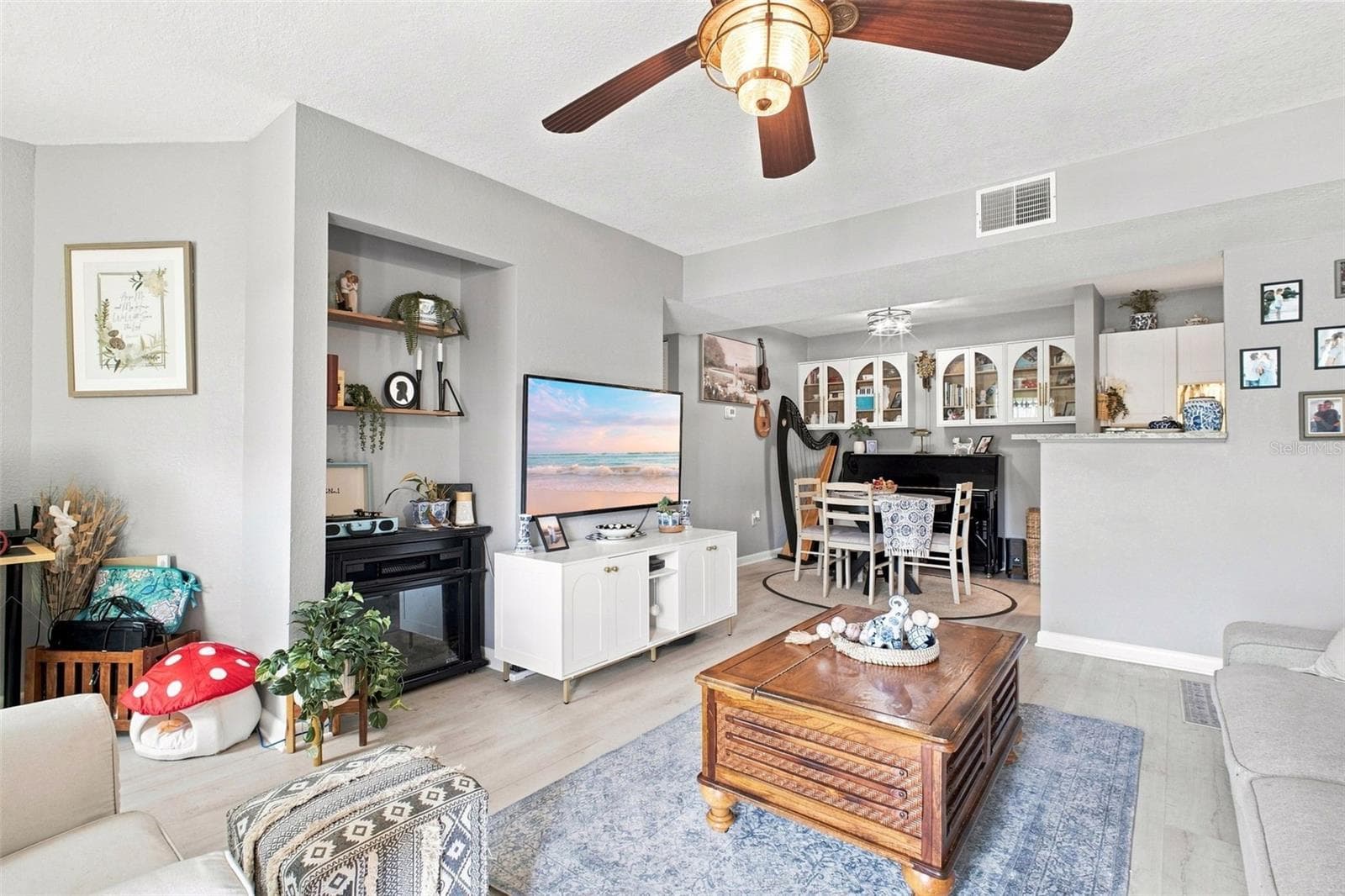 Living room into Dining area and kitchen - 455 ALT 19 S #17, PALM HARBOR