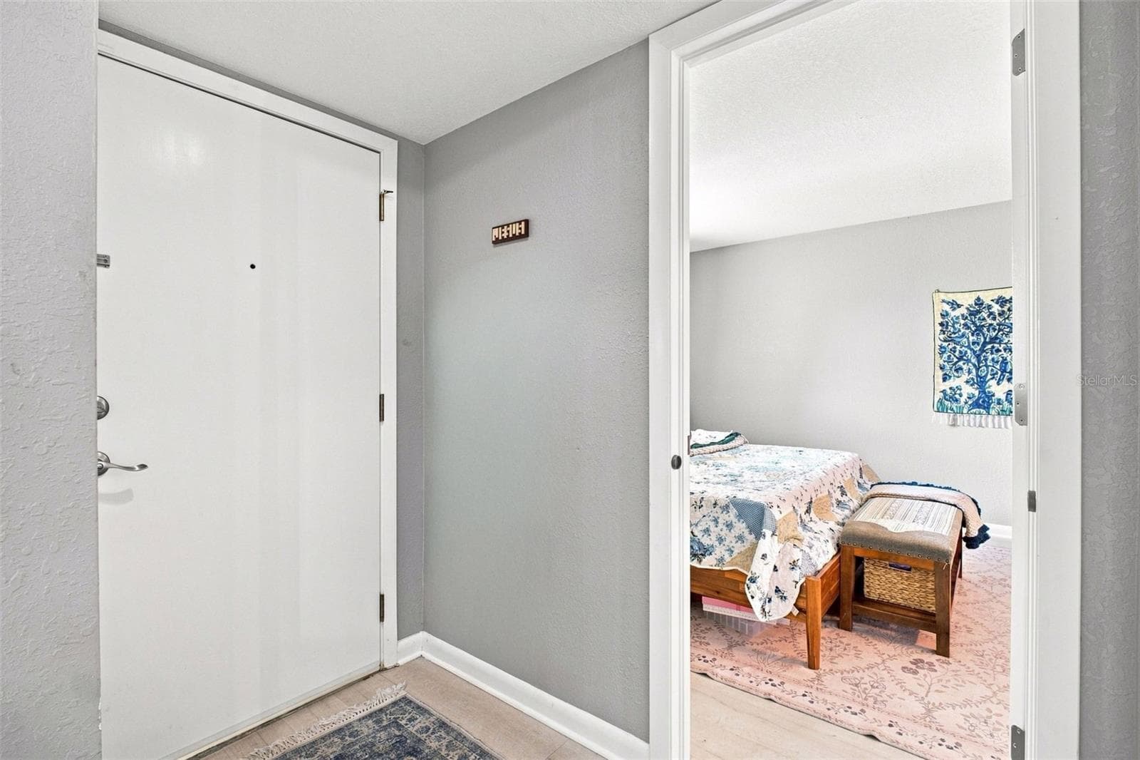 Front door and doorway to Primary Bedroom - 455 ALT 19 S #17, PALM HARBOR