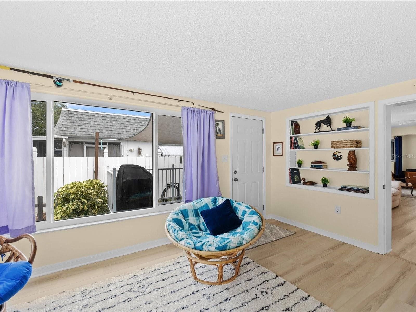 built in shelves and access to backyard - 3845 MING TREE DR, NEW PORT RICHEY