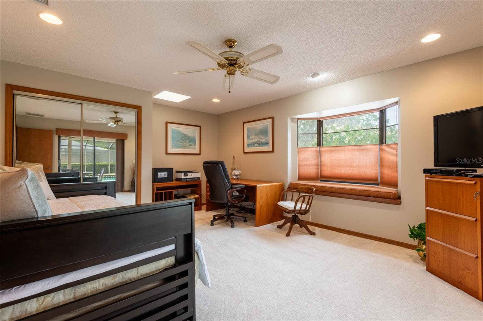 Large third bedroom/office/flex room leading out to the pool and golf course - 16509 E COURSE DR, TAMPA